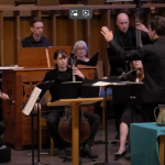 Director of Music leads an ensemble.
